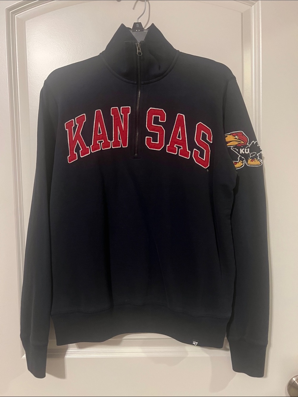 47’ Brand Navy 1/4 zip Sweatshirt with red Kansas Appliqué & Jayhawk on sleeve